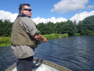 Mark fishes from the boat