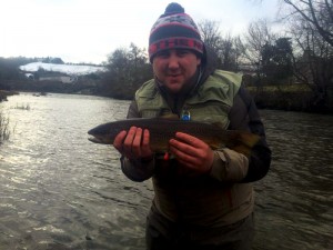 Large Brown Trout and Angler