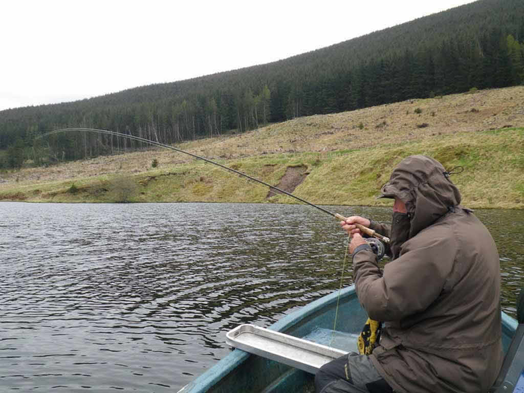 Tommy playing a fish