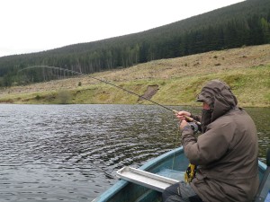 Tommy playing a fish