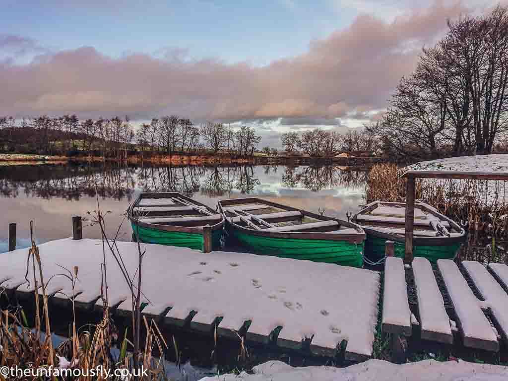 Boats in the snow at Swanswater