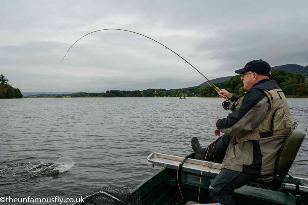 Pete Forrest fights a fish