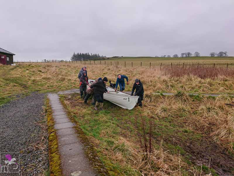 SCAC members launching the boat